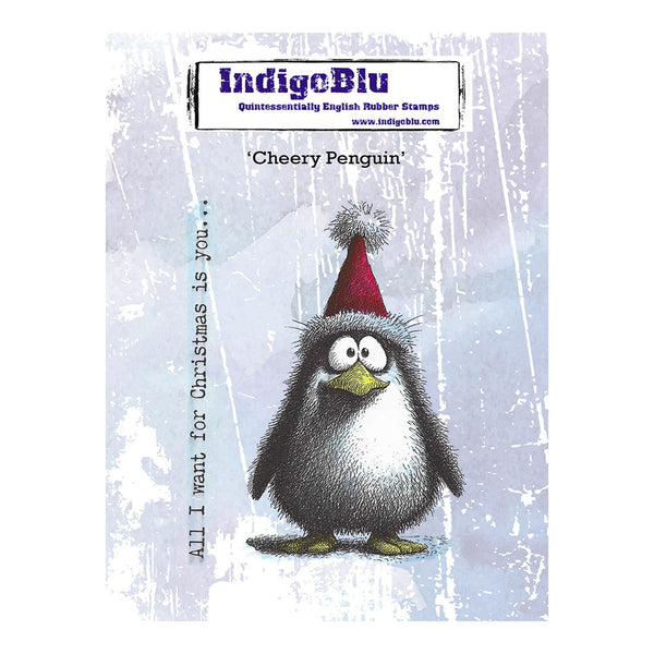 IndigeBlu 'Cheery Penguin' rubber stamp card featuring a cartoon penguin wearing a red Santa hat, with the text 'All I want for Christmas is you.