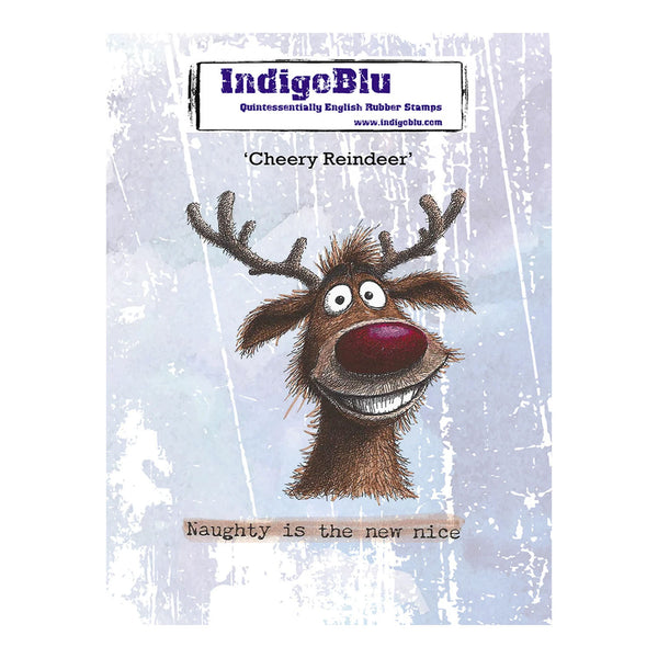 A product card for an IndigeBlu rubber stamp featuring a cartoon Christmas reindeer with antlers, a red nose, and the text 'Cheery Reindeer' and 'Naughty is the new nice' on a distressed light blue background.
