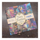 A square craft paper pack titled 'Fairy Fantasy' by IndigoBlu, featuring a colorful collage of woodland and mushroom scenes, displayed on a dark wood background.