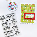 A holiday-themed crafting set featuring a scalloped card with green Christmas string lights and a red 'Tie the Season to be Jolly' panel, alongside a sheet of clear stamps with festive phrases and a hanging ornament tag.