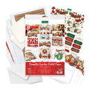 A card making kit package labeled 'Pinsetto Garden Picket Fence Card Making Kit' surrounded by included craft supplies on a white background, including patterned cards, envelopes, and decorative sheets with red, green, and white holiday designs.