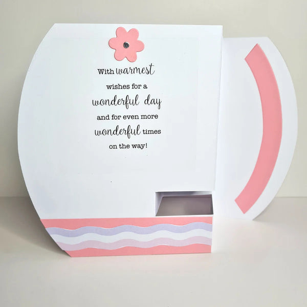Greeting card with pink flower and text on a white background