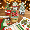 Collection of Christmas-themed decorative items on a wooden surface with a blurred festive background.