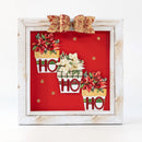 Decorative wall art with Christmas-themed elements in a white frame.