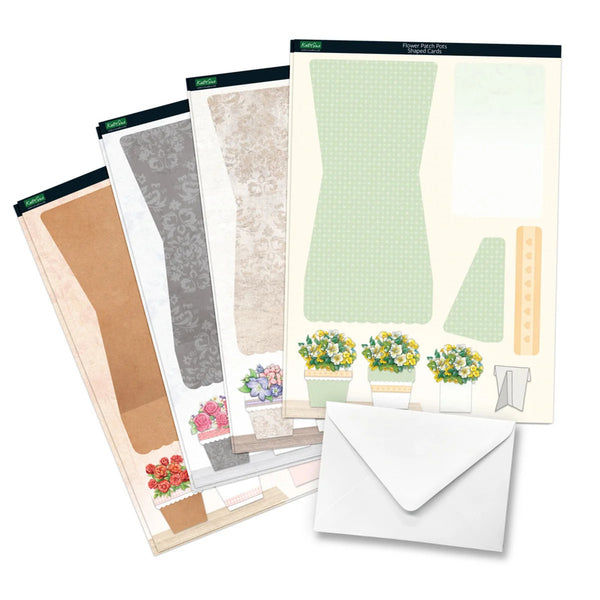 Set of paper crafting sheets with floral designs and an envelope on a white background
