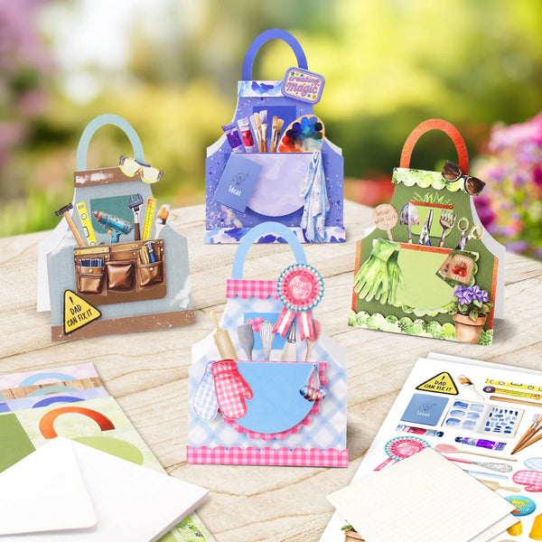 Four colorful gardening-themed gift bags arranged on a wooden table with gardening stickers and cards in the foreground, set against a soft blurred garden background.