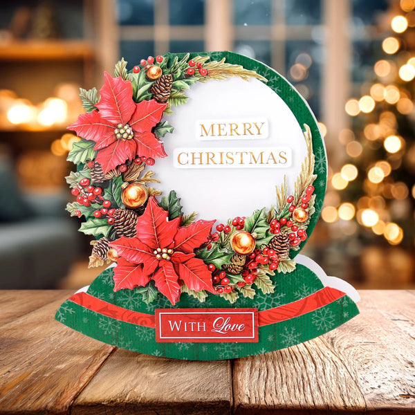 Decorative Christmas card with poinsettias and mistletoe on a wooden surface.