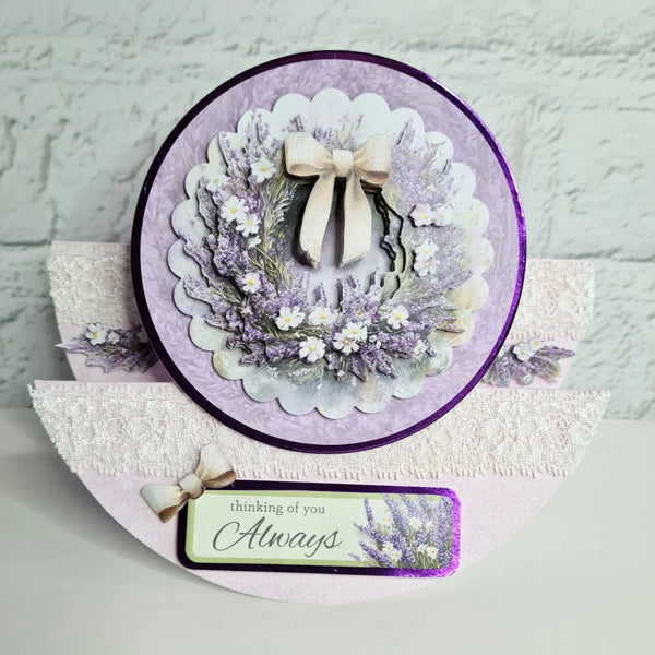 Decorative card with floral design and 'thinking of you Always' message on a textured surface.