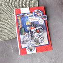 Greeting card with motorcycle illustration and 'Happy Birthday' text on a textured surface
