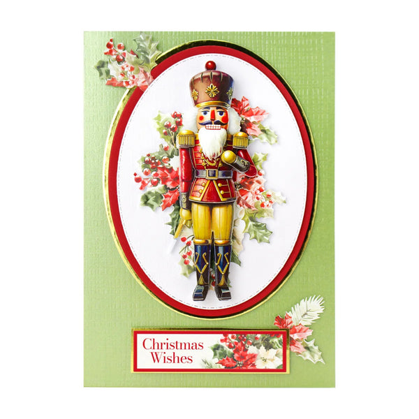 Christmas card with a nutcracker design and 'Christmas Wishes' text on a green background.