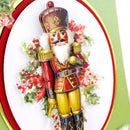 Colorful nutcracker toy with holly leaves and berries on a decorative card.