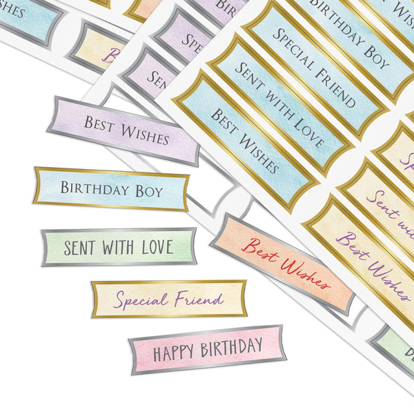 A set of decorative planner stickers with birthday and celebration messages, including 'Best Wishes', 'Birthday Boy', 'Sent with Love', 'Special Friend', and 'Happy Birthday', shown in pastel colors with gold borders on a white background.