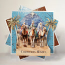 Christmas card with three wise men on camels and 'Christmas Wishes' text.