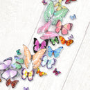 Colorful butterfly decorations on a white wooden surface