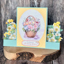 Greeting card with floral design and 'Sending you Birthday Wishes' text on a wooden stand.