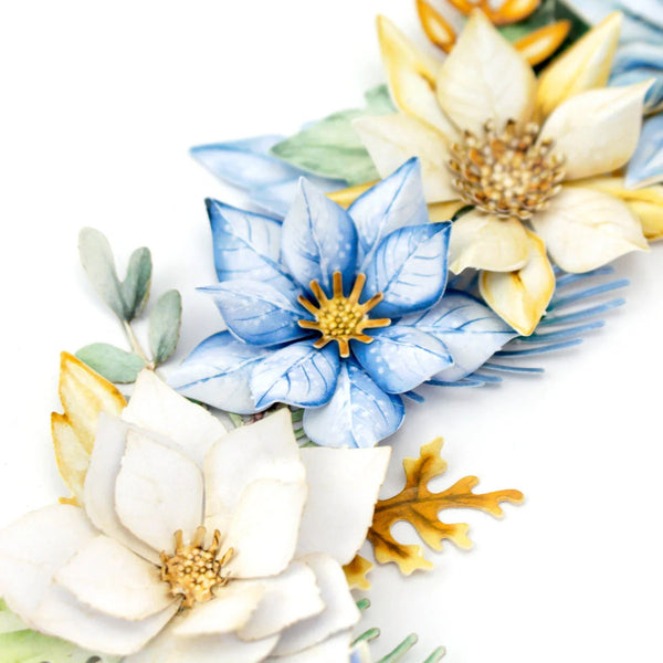 Decorative floral arrangement with blue, white, and gold flowers on a white background