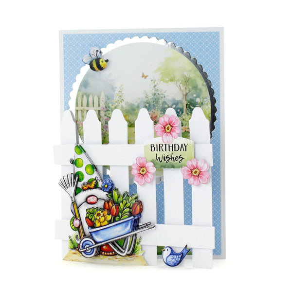 Greeting card with garden-themed design, including a wheelbarrow, flowers, and a bee, on a white background.