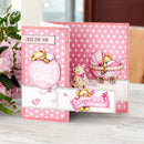 A pink and white polka dot baby shower 'It's a Girl' and congratulations card set with cute teddy bear illustrations, displayed on a light wooden surface next to pink roses.