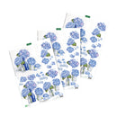 Three sheets of Hydrangea Birthday stickers arranged in an overlapping fan layout on a solid white background. The stickers feature watercolor-style blue and purple hydrangea bouquets in glass jars, scattered flower petals, and 'Happy Birthday' text.