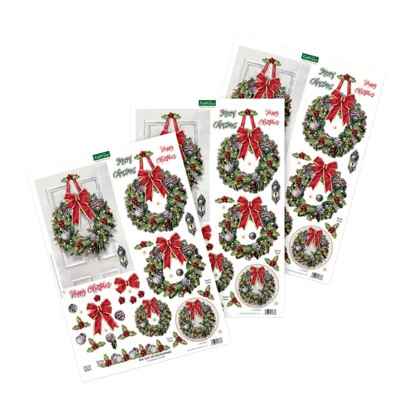 Four sheets of Christmas door wreath decals arranged on a white background, featuring green wreaths with red bows, pinecones, ornaments, and holiday decorations.