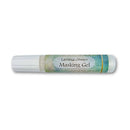 A tube of Lavinia Stamper Masking Gel with a white cap and a decorative label featuring green and blue watercolor-style patterns, set against a plain white background.