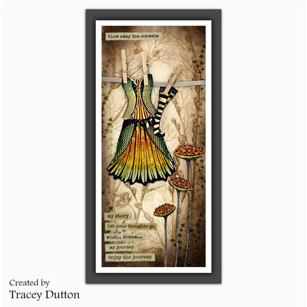 A framed vertical art print featuring a stylized dress hanging on a clothesline with floral and botanical elements, plus text panels. The print is shown in a dark frame against a light gray background, with 'Created by Tracey Dutton' text at lower left.