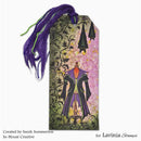 A decorative gift tag featuring a gothic-style illustration of a cloaked figure, bats, and hanging lanterns, with a purple tassel. Text at the bottom reads 'Created by Sarah Summerton In-House Creative for Lavinia Stamps'.