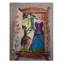 A decorative miniature display box or shelf with open sides, featuring whimsical illustrated garments and nature motifs on a tiled gray background.