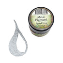 A small jar of metallic pigment labeled 'Metal Pigment Sparkling Silver' shown next to a textured silver smear on a plain white background.