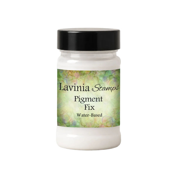 A jar of Lavinia Stamps Pigment Fix water-based pigment powder, featuring a black lid and a green and yellow marbled label on a white background.