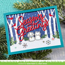 A handmade layered card featuring a winter forest scene with white birch trees, snow, red birds, and the words 'Seasons Greetings' in red script. The card has a turquoise border and is styled with green pine branches and a turquoise fabric background.