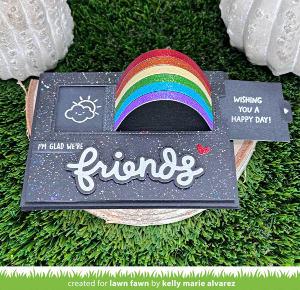 Decorative card with rainbow and text on a grassy background