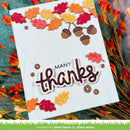 A handmade autumn-themed greeting card with 'MANY thanks' in raised glittery lettering, decorated with layered die-cut fall leaves and acorns. The card is displayed on a textured teal surface surrounded by dried orange and red leaves.