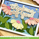 Card with 'Thinking of you' text and floral designs on a blue background