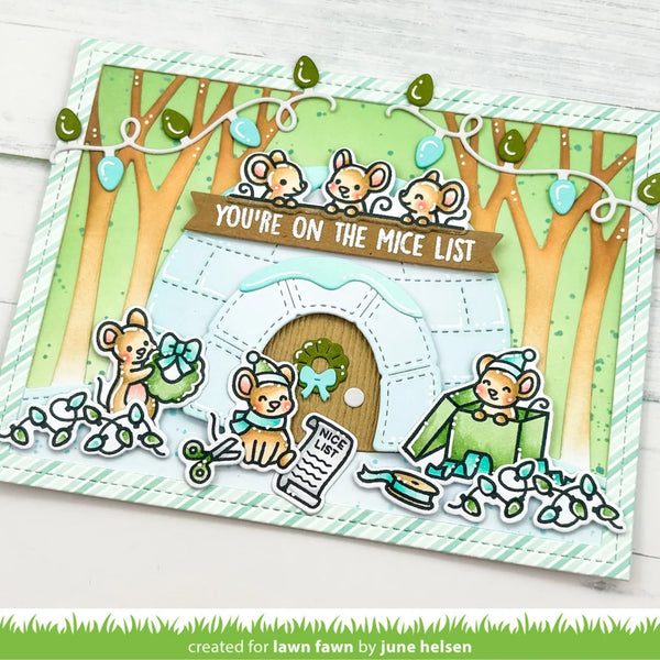 A handmade layered card featuring cute cartoon mice around an igloo with the text 'YOU'RE ON THE MICE LIST'. The card has a green and white striped border, decorative leaves, and small mouse cutouts, photographed on a light wood background.