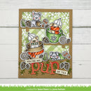 A handmade greeting card featuring cute cartoon dogs drinking tea in teacups, decorated with pinecones, snowflakes, and the text 'YOU'RE MY PUP OF TEA'. The card is displayed on a white wood panel background.