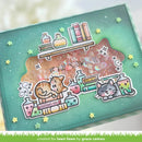 A handmade scrapbook card or journaling page featuring a teal background with a glittery pink central panel, cartoon cats, potion bottles, books, stars, and small yellow star accents. A watermark at the bottom reads 'created for lawn fawn by grace camou'.