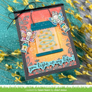 A handmade greeting card featuring a fairy-themed design with two cartoon bunnies holding lanterns, a window with stars, and the text 'you light up my life!'. The card is styled on a textured teal fabric with yellow flowers.