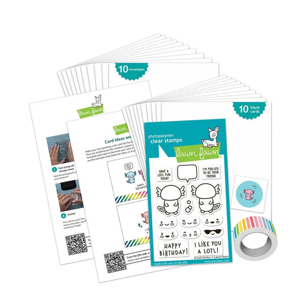 A craft kit set from Laum Bawn featuring a clear stamp sheet, a roll of colorful patterned tape, and several printed card templates and instruction sheets arranged on a white background.