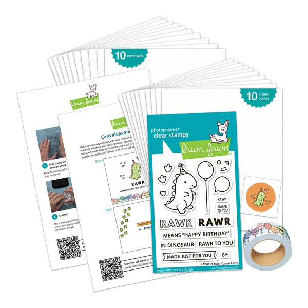 A craft kit layout featuring a clear stamp card package labeled 'rawr clear stamps' by Lawn Fawn, surrounded by printed card templates, a roll of decorative tape, and a small sticker on a white background.