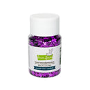 A small clear plastic jar filled with purple and black star-shaped craft confetti, topped with a white ribbed cap and labeled 'lawn faw fundamentals tiny treasures purple stars confetti' on a white background.