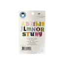 A package of 18 Lil Davis Designs 'Art Department' alphabet embellishments in a rainbow of colors, displayed on a white backing card with a barcode and product details.