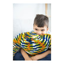 Child wearing a colorful striped sweater with a white background