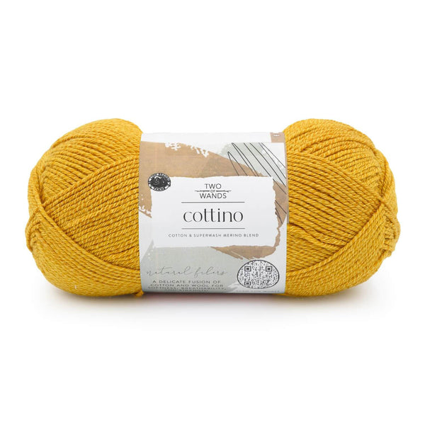 Yellow yarn ball with a label on a white background