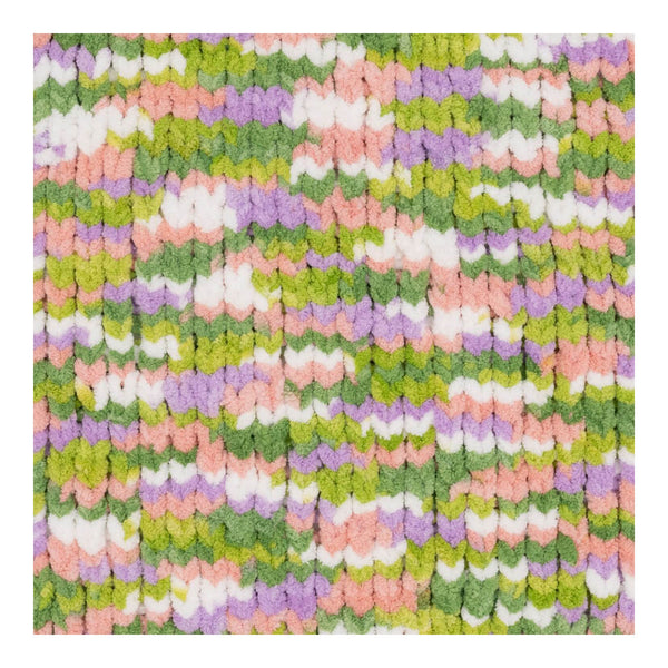 Multicolored textured fabric with a pattern of green, pink, and purple.