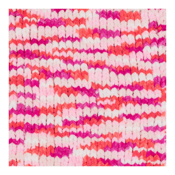 Textured fabric with pink, white, and orange pattern on a white background