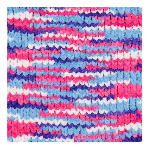 Multicolored textured fabric with pink, blue, and white pattern