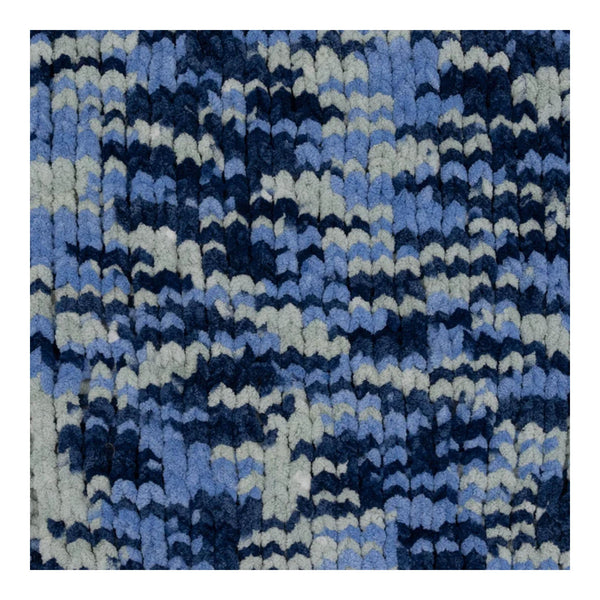 Blue and white patterned rug on a plain background