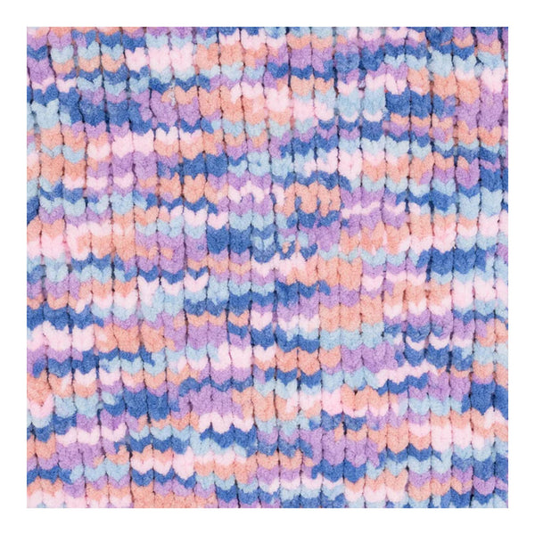 Multicolored textured fabric with a pattern of small, irregularly shaped pieces.