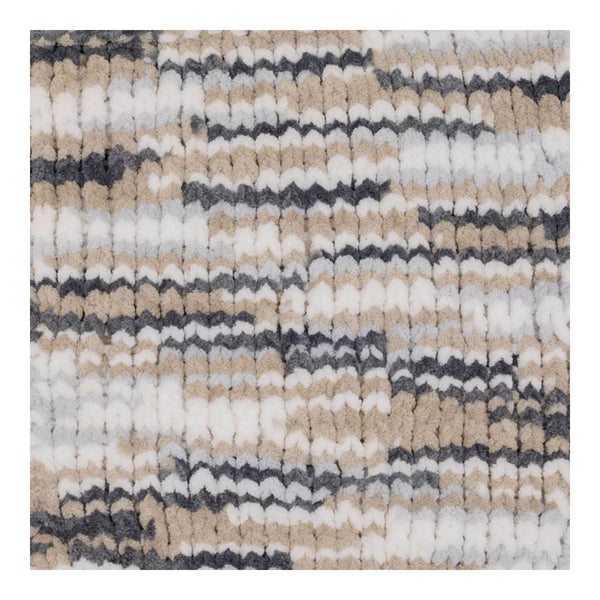 Textured area rug with a pattern of beige, gray, and white stripes on a white background